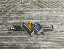 Silver Toned Wonder Women Pendant With Blue And Yellow Gemstone