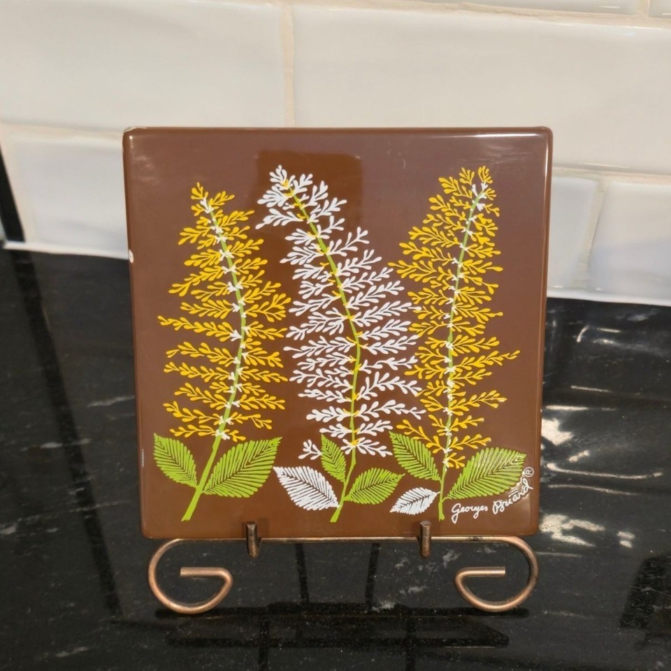 Georges Briard is a legitimate mid-century design icon, and this dual-purpose metal fern tile — trivet AND wall art — is a clever, collectible find.