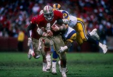 Running back Tom Rathman San Francisco 49ers attempts to break a t- Old Photo
