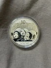 2013 SILVER PANDA 1 Oz.  .999 SILVER COIN --  10 Yuan ...  Slightly toned.