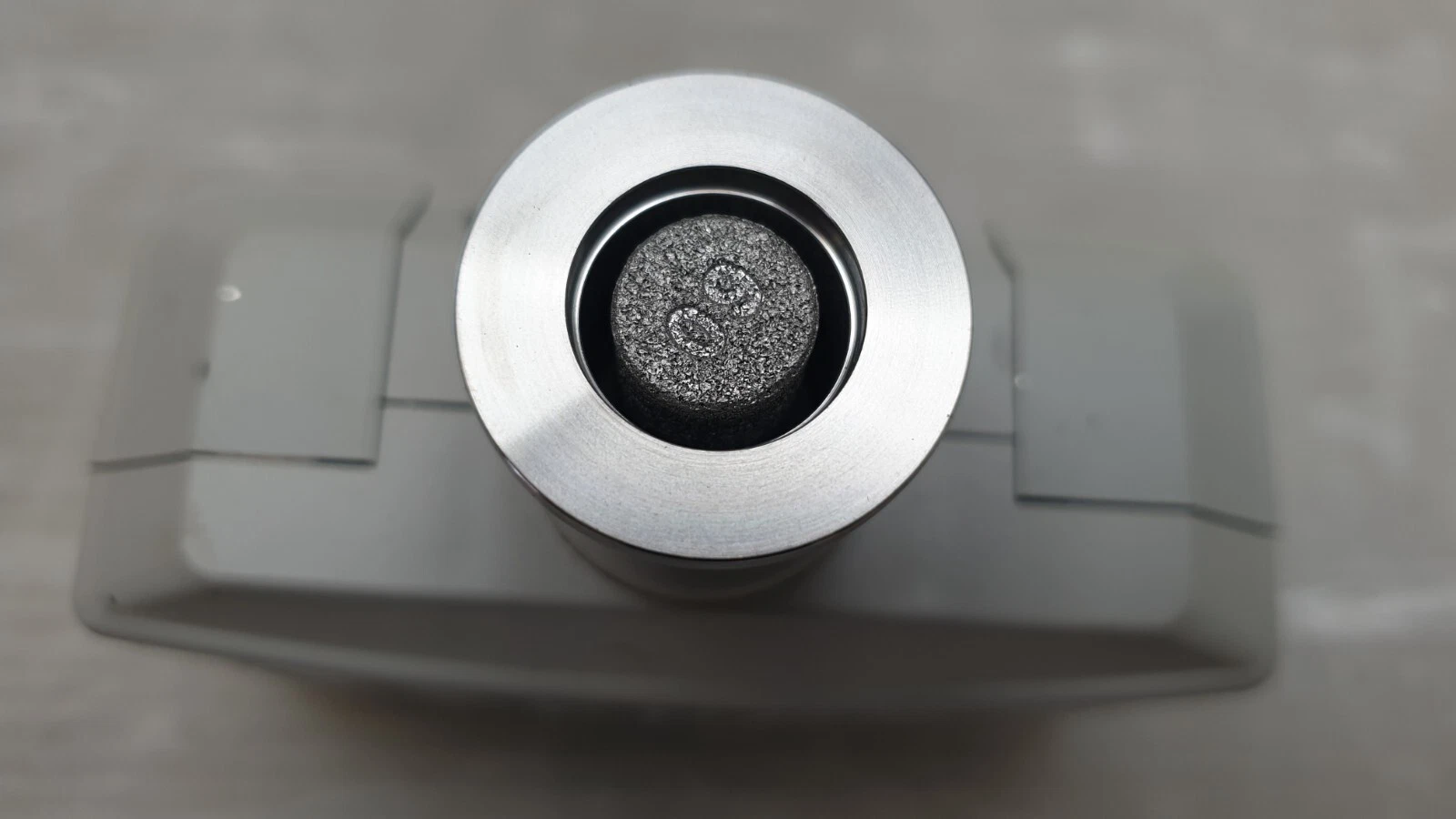 Close-up of the M-320XG stainless flange port with its inner screen