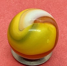A Vintage Akro Agate Four Color Corkscrew Marble. Measures .65 Inch. Good.