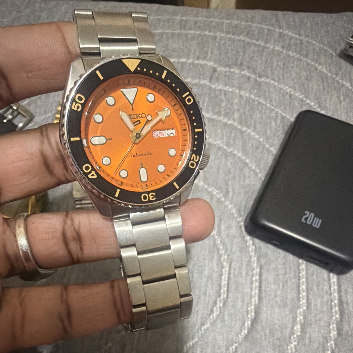 Seiko 5 Automatic Orange Dial Day/Date Diver Black Bezel Steel Bracelet View 4