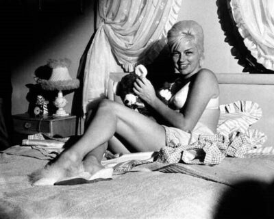 Diana Dors smiling as she sits on bed in bra and panties 1960's 11x17 poster
