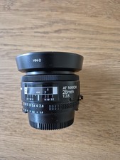 Nikon Nikkor 28mm F/2.8 AF lens with metal lens hood.