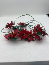 VINTAGE WEIHNACHTSLICHTERSTRANG MIT KUNSTSTOFF-PONSETTES ÜBERLICHT SCHIEBEN