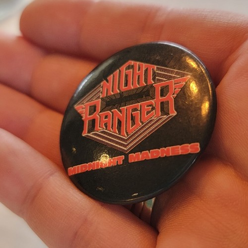 Black oval pin with red “Night Ranger” text, white diamonds, and “Midnight Madness” lettering.