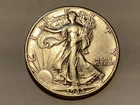 1945-D Walking Liberty half dollar in (EX to AU) condition