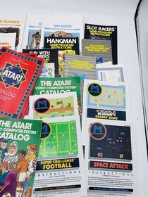 Atari 2600 Console W/ Game Center, Joysticks, Paddles, Manuals  And Games