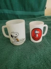 Vintage Snoopy FireKing Milk Glass Mug And Snoopy Avon Milk Glass Mug