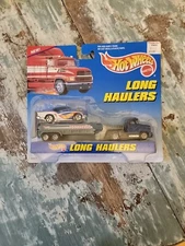 HOTWHEELS LONG HAULERS SEMI TRUCK W/ 1957 CHEVROLET BELAIR NEW IN 1997 PACKAGE