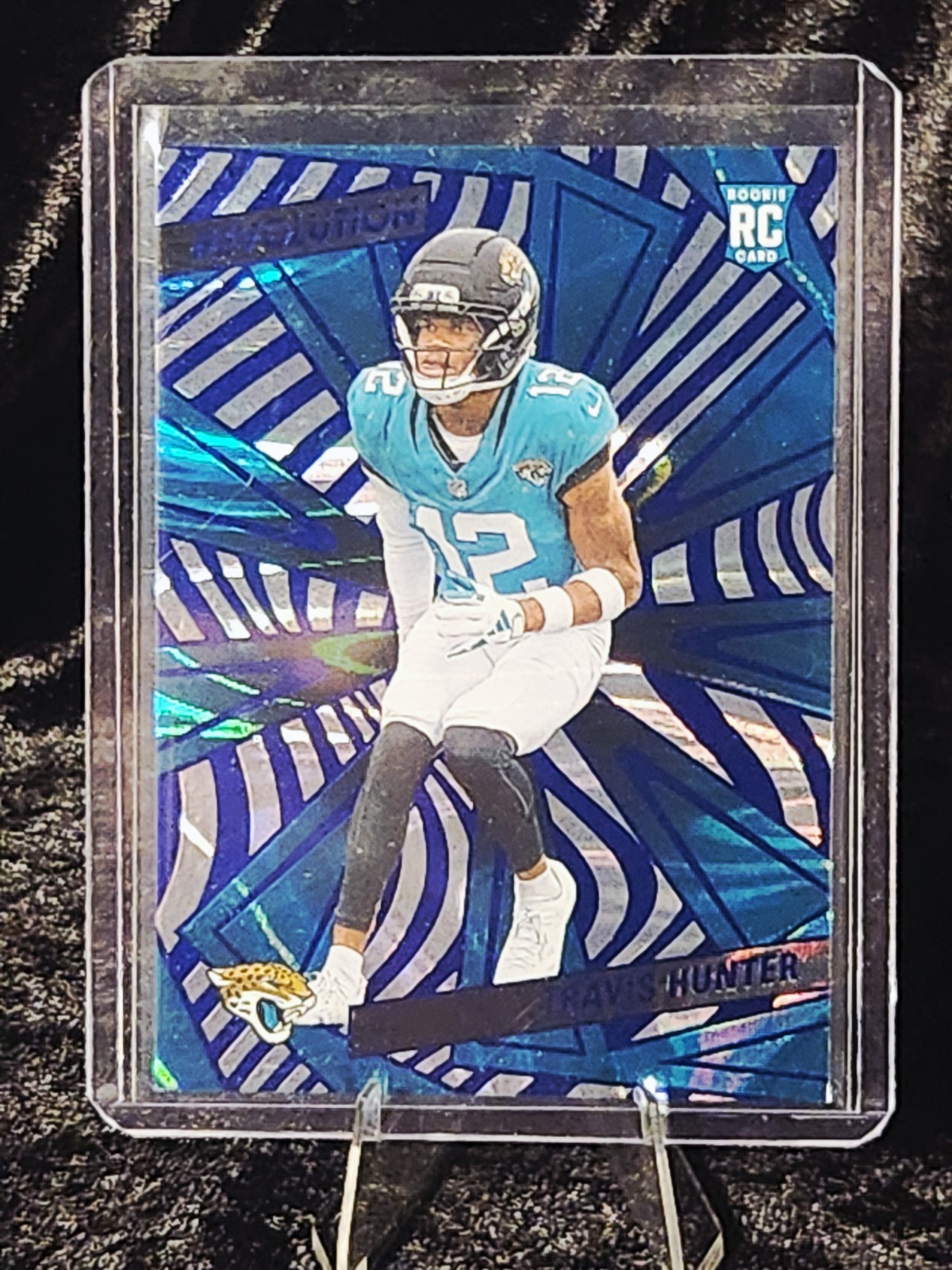 2025 Revolution - Travis Hunter (RC) - Blue Swirl /99 - Jaguars