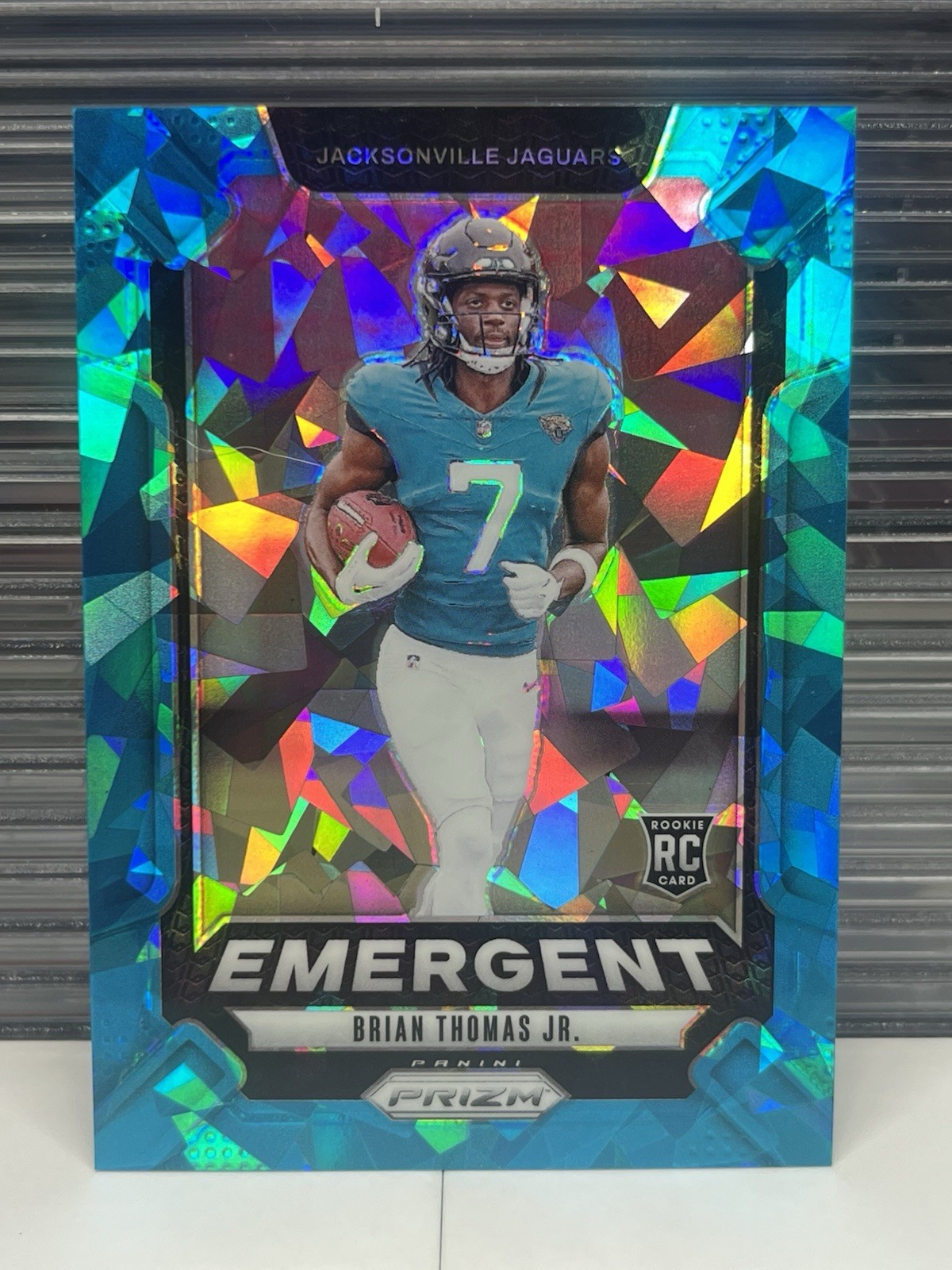 2024 Panini Prizm #12 Brian Thomas Jr. Emergent Blue Ice Prizm /99 RC
