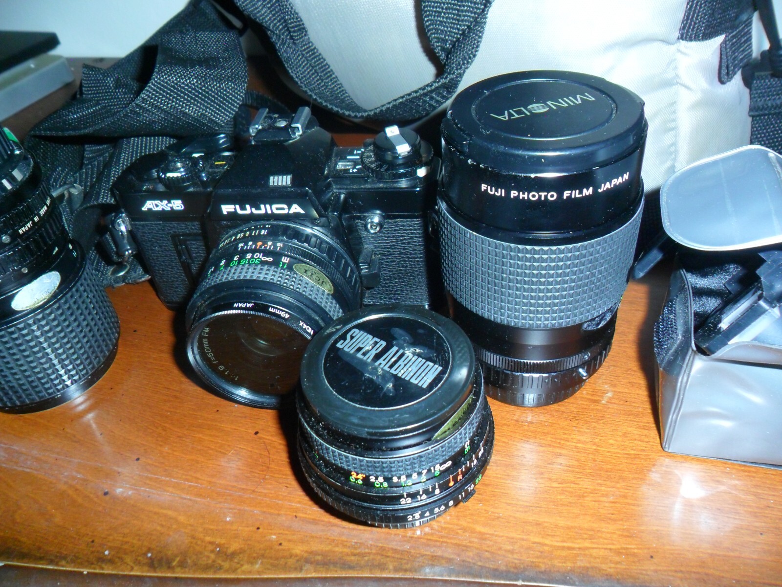 Fujica AX5 w/DM CAMERA LOT 3 XTRA LENS, BOOKLETS CASE ETC. AS IS