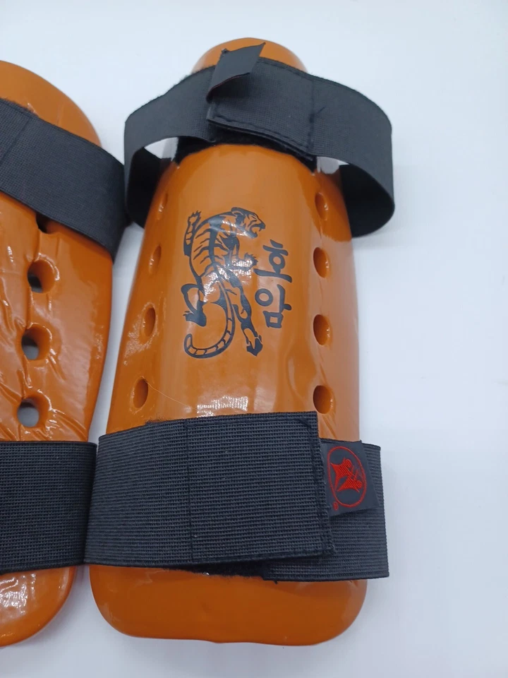 Equipo de ahorro de artes marciales Macho espinilleras juveniles patrón naranja tigre 11 pulgadas Foto 3 de 4