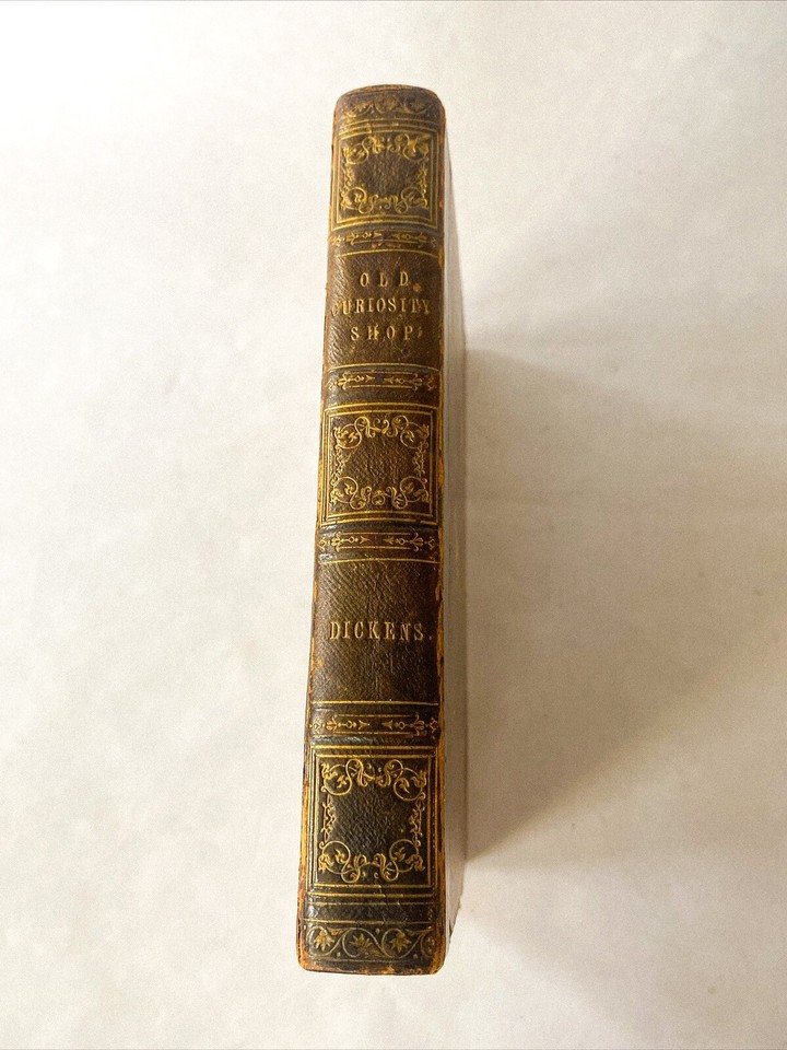 An 1848 leather-bound Charles Dickens 'Old Curiosity Shop' — a real Victorian artifact that doubles as a literary objet d'art.