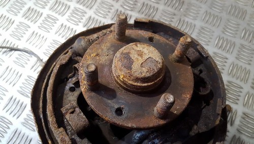 Mazda 323F 1999 Steering knuckle - rear left used, Genuine #482164-09