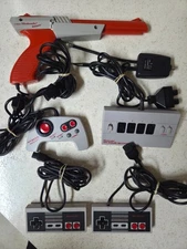 NINTENDO NES ACCESSORIES LOT: FOUR SCORE, MAX, CONTROL PADS, ZAPPER, & RF SWITCH