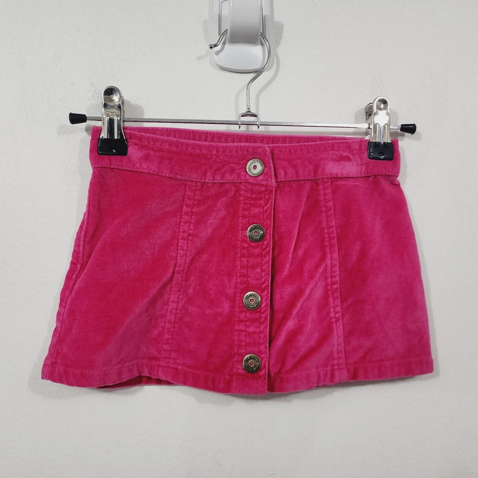 Mini falda Toughskins de terciopelo para niña pequeña línea A rosa magenta talla 2T frente a presión Foto 2 de 4