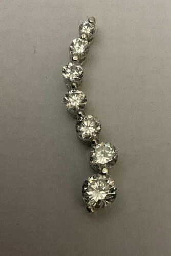 10k White Gold Pendant With Seven Graduated Cubic Zirconia Stones