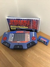 JEOPARDY ELECTRONIC HANDHELD GAME TIGER WITH CARTRIDGE AND ANSWER& QUESTION BOOK