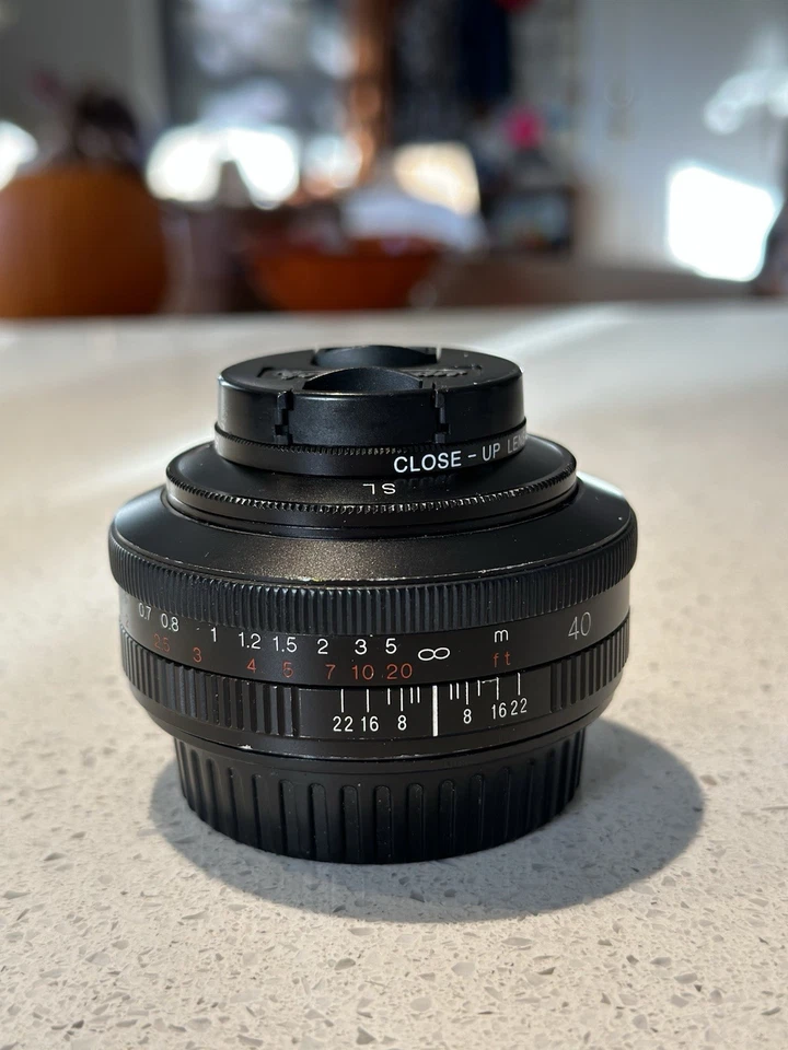 Voigtlander Ultron 40mm f/2 SL ii N para Canon EF con capucha y adaptador macro Foto 4 de 4