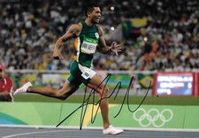 wayde van niekerk runs through the final to winning race signed 12x8 photo