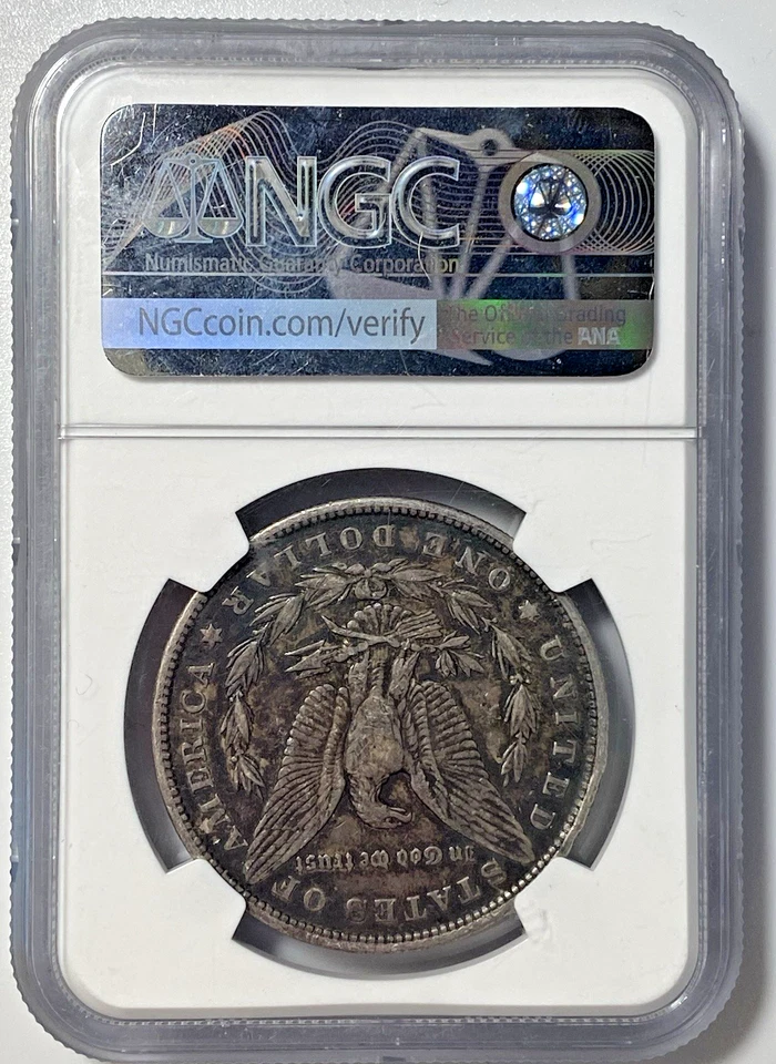 1878 7TF REV OF 79 $1 Morgan Silver Dollar. 90% Silver. NGC Genuine KM#110 - Image 2 of 4