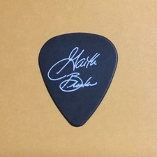 Garth Brooks guitar pick, white print on black