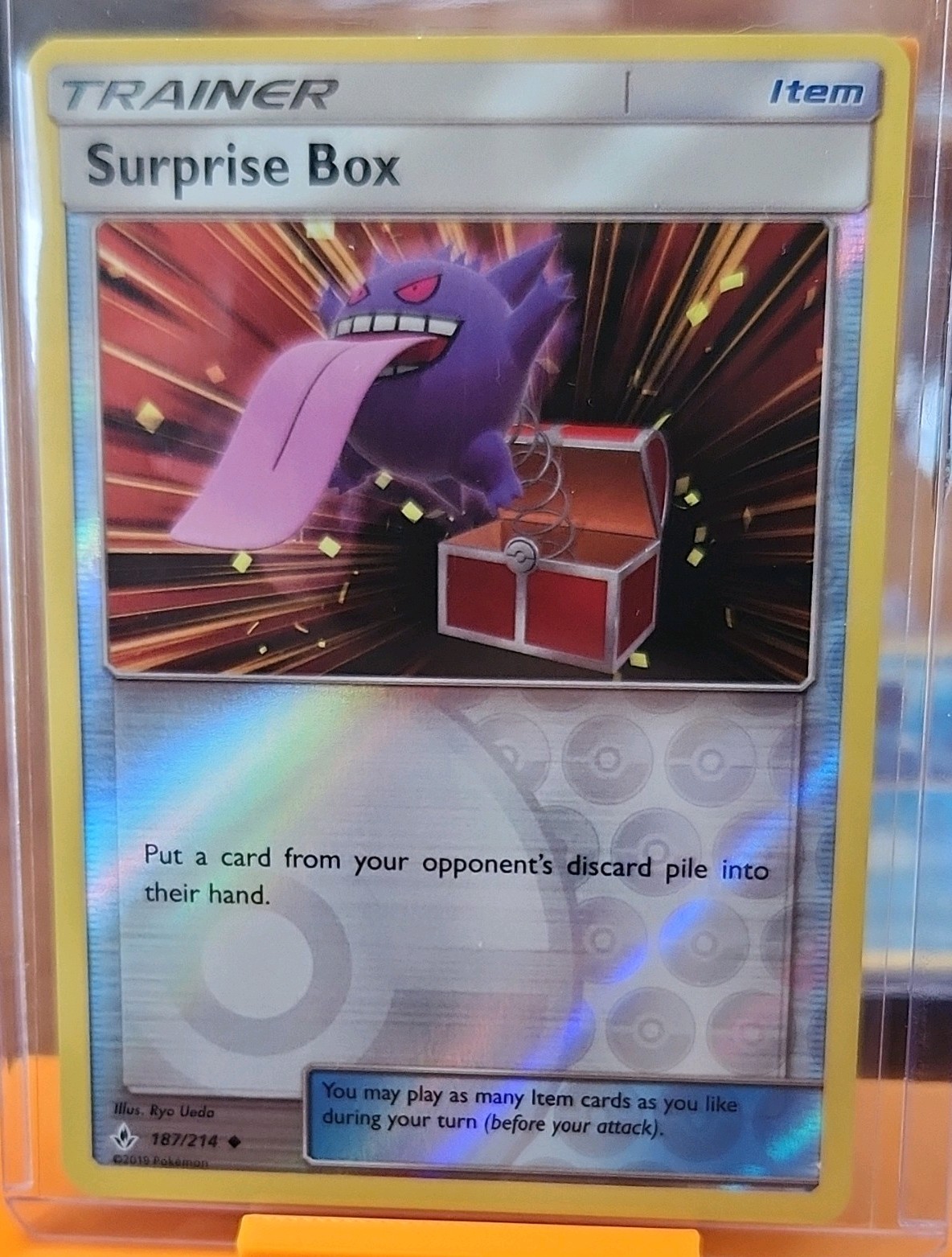 Surprise Box 187/214 SM-Unbroken Bonds Reverse Holo English Trainer Uncommon