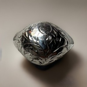 Vintage etched sterling silver dome ring with floral motifs.