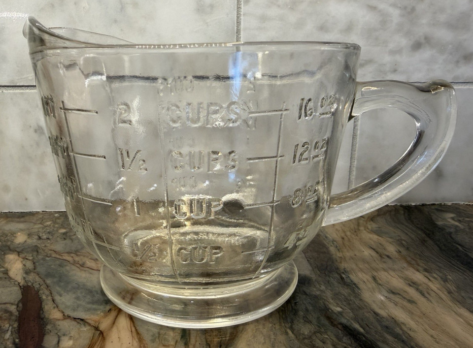 A genuine vintage Spry glass measuring pitcher — the kind of mid-century kitchen piece that looks better on a shelf than most modern décor.