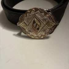Used ladies Montana Silversmith belt buckle with black western belt
