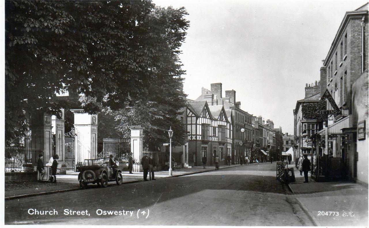 Church Street Oswestry motor car unused RP old postcard Good condition