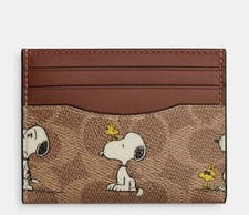 COACH X PEANUTS SLIM ID CARD CASE IN SIGNATURE CANVAS WITH SNOOPY PRINT