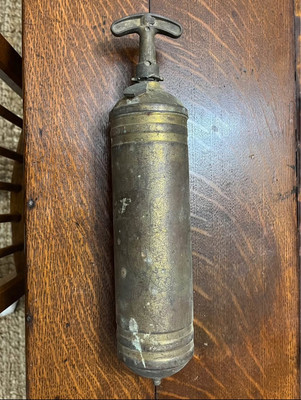 Vintage empty brass fire extinguisher