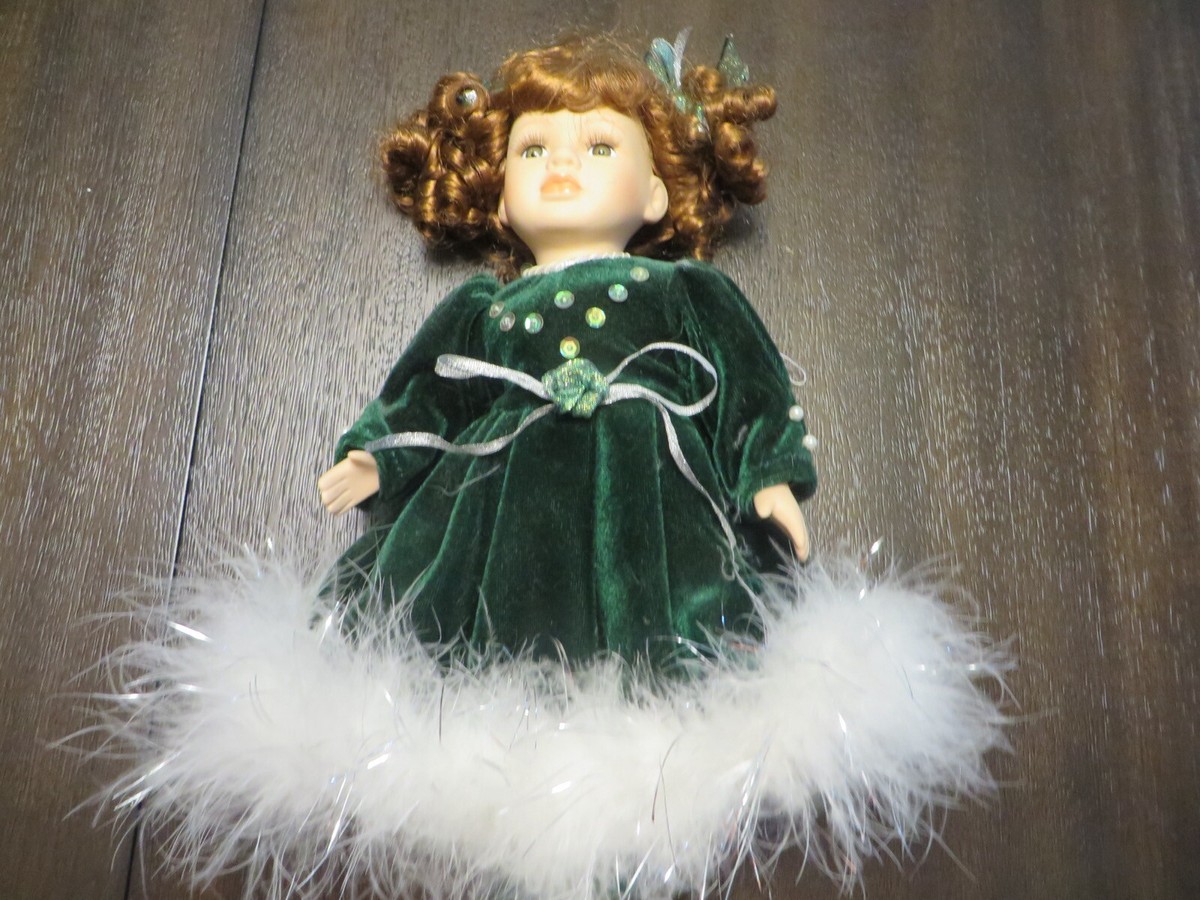 porcelain doll with green velvet dress Bisque Blonde Caterpillar Bug Marie Osmond Signed Collectible Face Gown Whimsical Girl Birthday Gift Lace Apron This Charming Doll Features A Luxurious Velvet Outfit In Deep Green With Elegant White Lace Accents PORCELAIN DOLL HERITAGE Collection Green