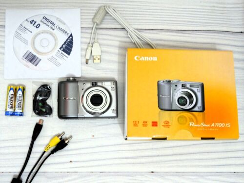 NEW! Canon PowerShot A1100 IS 12.1MP Digital Camera - Silver - NEVER USED - Afbeelding 1 van 12