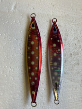Two 300 Gram Jigs With Glow and Holographics