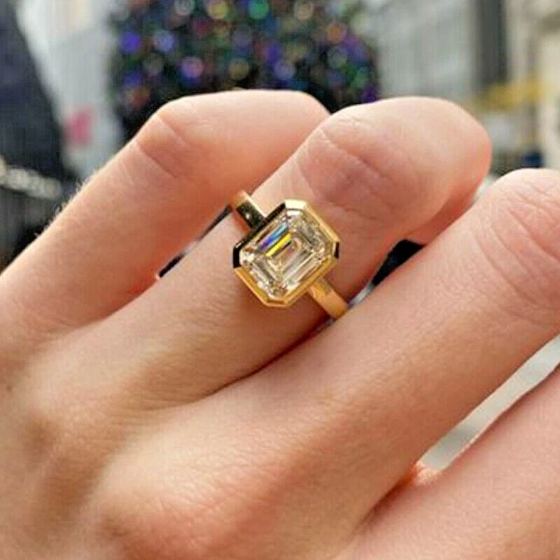 Emerald bezel engagement ring deals