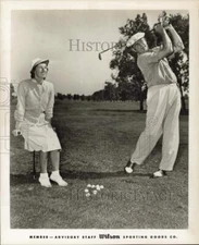 1959 Press Photo Jim Ferrier hits golf balls as wife Norma watches. - hpx08886