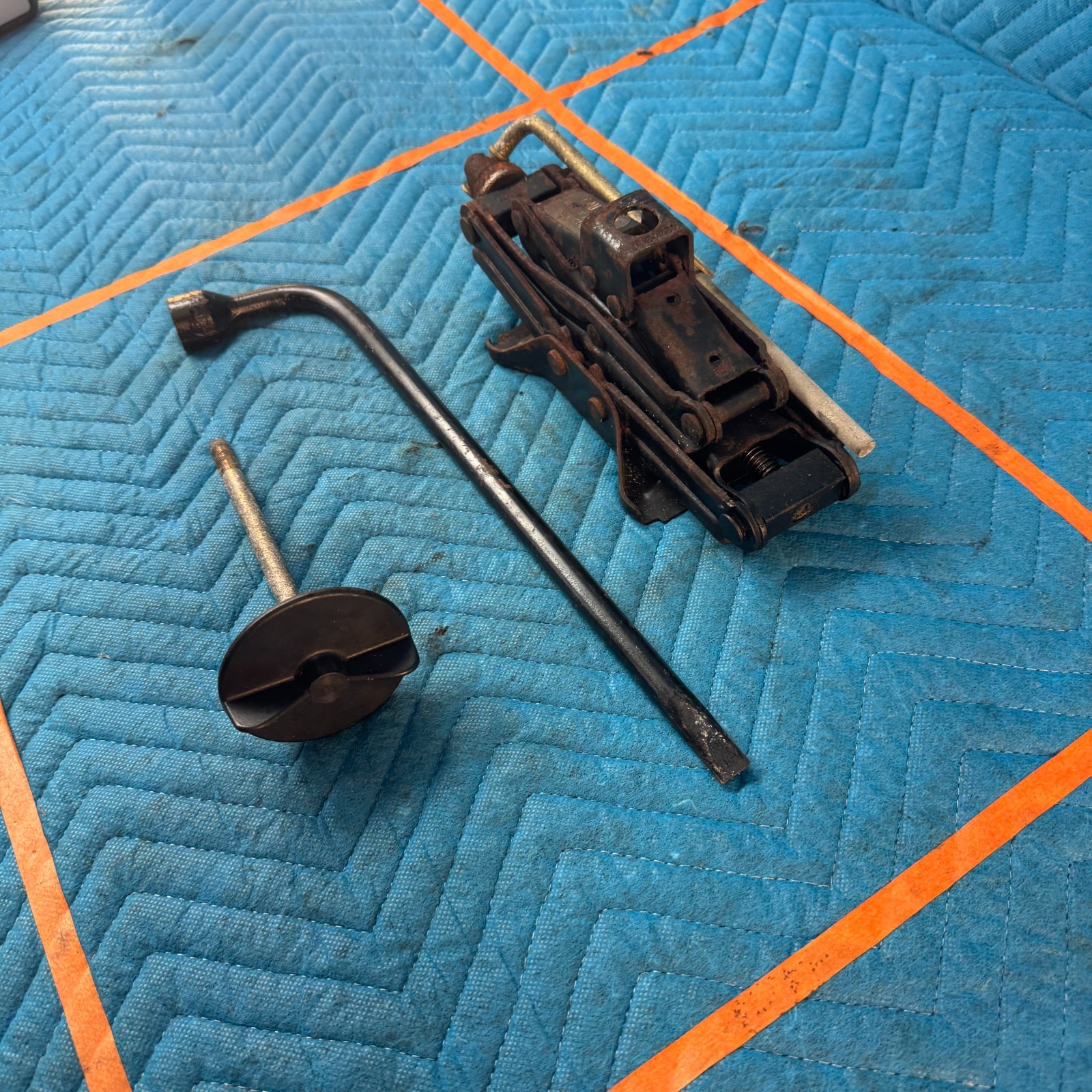 1989-1991 Chrysler TC Maserati Scissor Jack Lug Wrench Hold Down OEM 46K