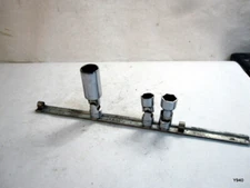 Snap on socket rail with 5 clips  and 3 sockets.   See description for details