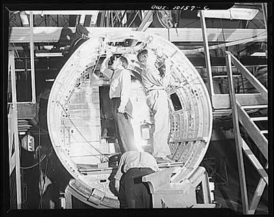 #ad Detroit Michigan. Inspectors checking a center section De Soto bomber plant $12.99