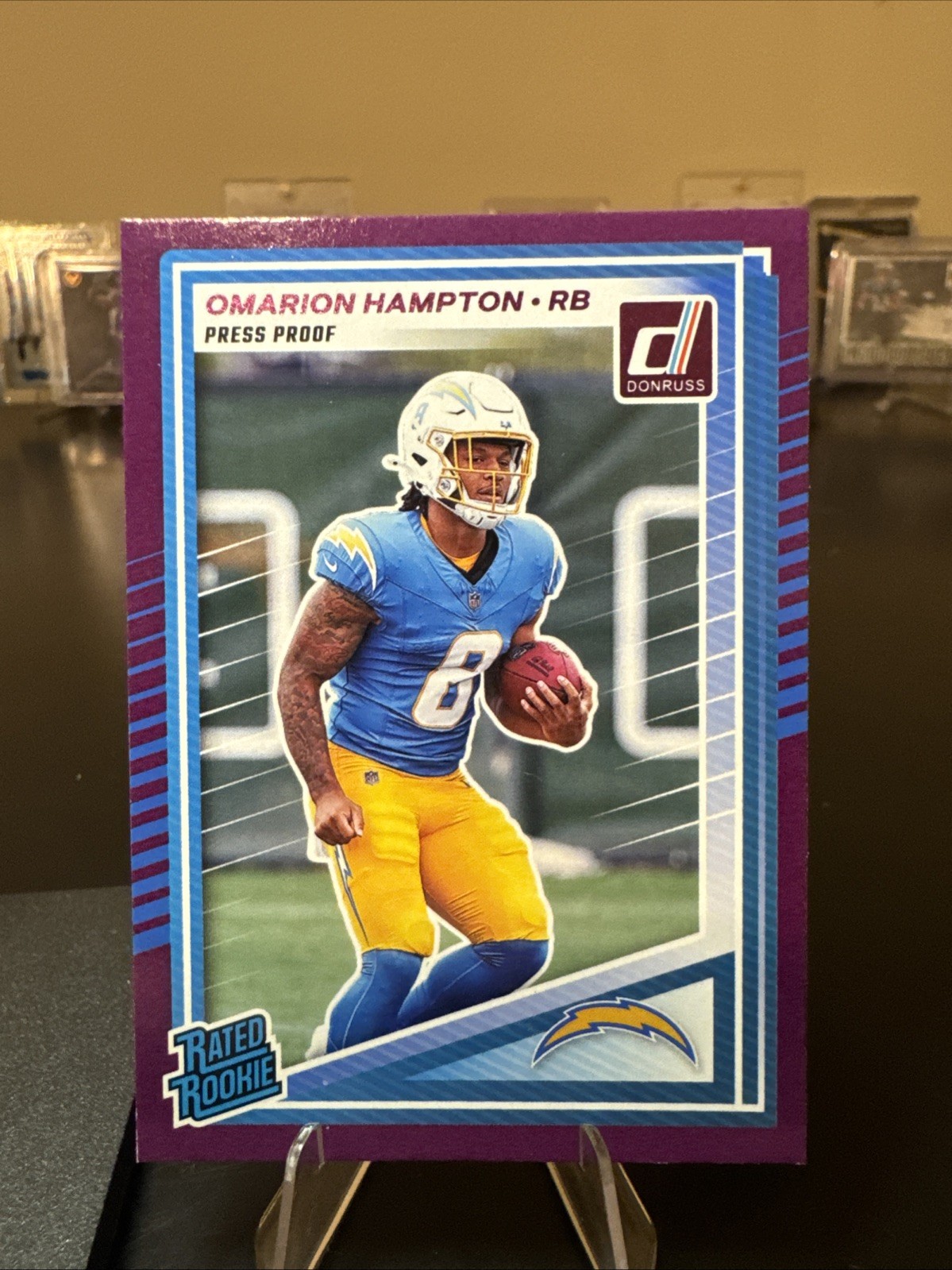 2025 Panini Donruss - Rated Rookie Omarion Hampton #303 Purple Press Proof (RC)