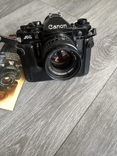 Canon A-1 Black SLR Film Camera w/ Canon 50mm f/1.4 Lens, Manuals Case