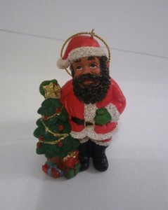 African American Santa Black Santa Claus Next To X Mas Tree