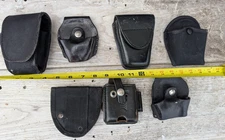 Lot of 7) Hand cuff cases etc radio, dutyman 8811u , premier, asp,