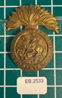 WW1 1915 Economy Issue All Brass Northumberland Fusiliers Cap Badge EB-2533