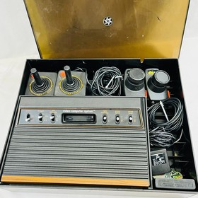 Atari 2600 Console Bundle: Joysticks, Paddles, Atari Force Comic, Organizer, Pin